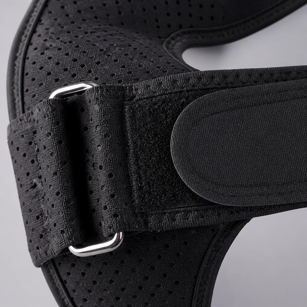 Close-up of the perforated neoprene strap, hook-and-loop tab and metal slider buckle